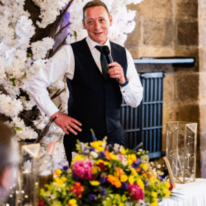wedding flowers and father of the bride giving toast